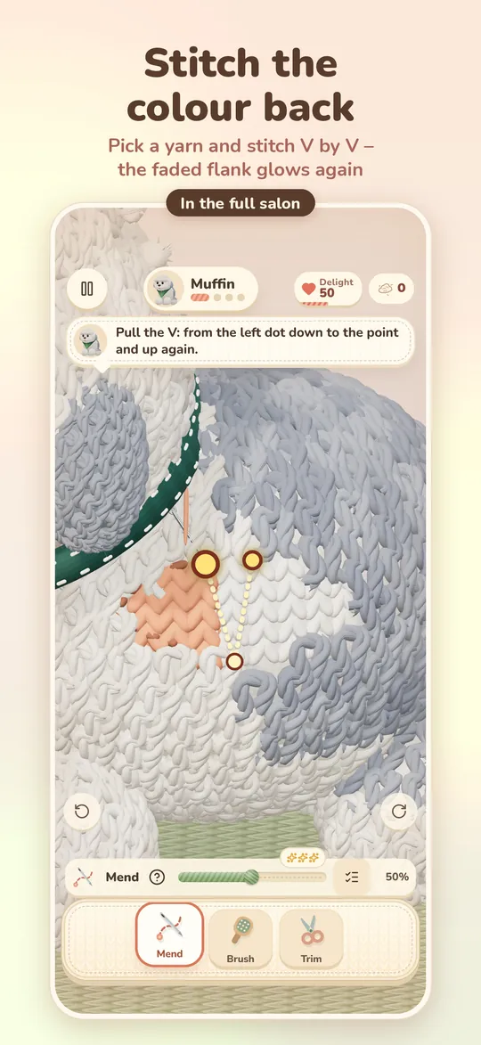 A faded spot is stitched back stitch by stitch with new yarn.